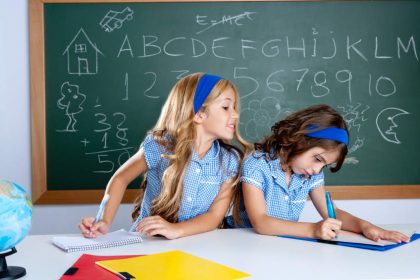 classroom with two kids students cheating on test